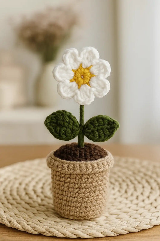 Crochet daisy pot sitting on a study desk as a productivity partner.